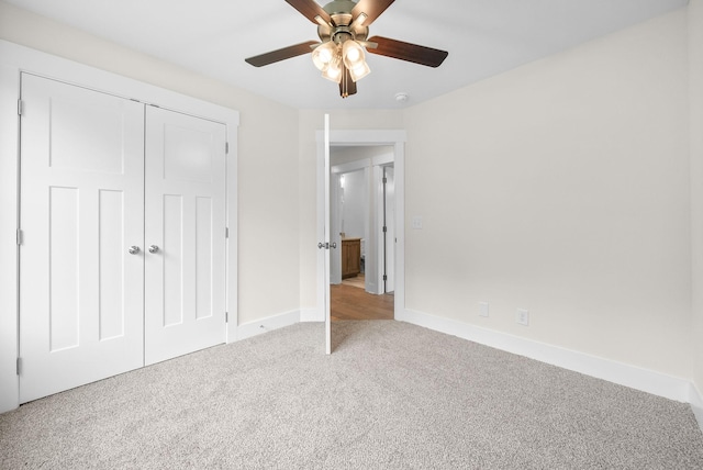 1928 Flats Rd, Cunningham, TN 37052 - unfurnished bedroom featuring carpet flooring, baseboards, a closet, and a ceiling fan