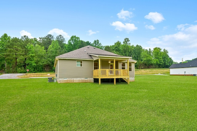 1928 Flats Rd, Cunningham, TN 37052 - back of property featuring a lawn, a shingled roof, crawl space, and a wooden deck