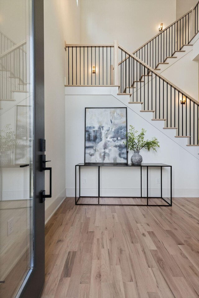 2801B W Kirkwood Ave, Nashville, TN 37204 - foyer with stairway, wood finished floors, a high ceiling, and baseboards