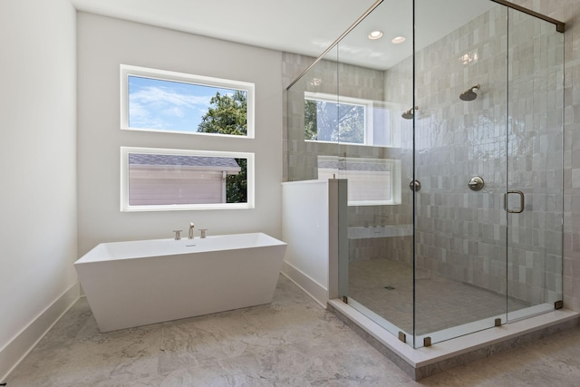2801B W Kirkwood Ave, Nashville, TN 37204 - full bath featuring a soaking tub, a shower stall, baseboards, recessed lighting, and marble finish floors