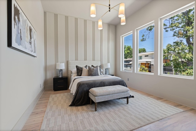 2801B W Kirkwood Ave, Nashville, TN 37204 - bedroom with light wood-type flooring, a chandelier, and baseboards