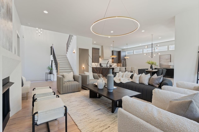 2801B W Kirkwood Ave, Nashville, TN 37204 - living room featuring stairs, light wood finished floors, and recessed lighting