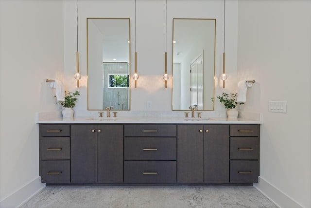 2801B W Kirkwood Ave, Nashville, TN 37204 - bathroom with baseboards, double vanity, an enclosed shower, and marble look tile flooring