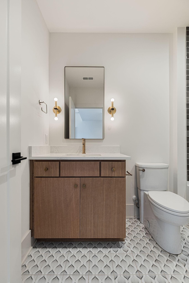 2801B W Kirkwood Ave, Nashville, TN 37204 - bathroom featuring vanity, toilet, and baseboards