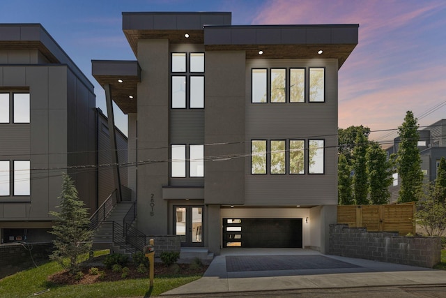 2801B W Kirkwood Ave, Nashville, TN 37204 - modern home featuring driveway, an attached garage, and stucco siding
