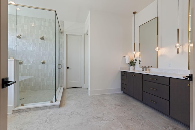 2801B W Kirkwood Ave, Nashville, TN 37204 - full bath featuring vanity, a stall shower, baseboards, and marble finish flooring