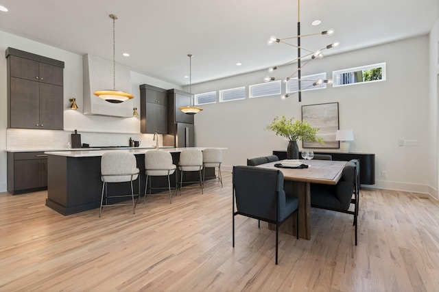 2801B W Kirkwood Ave, Nashville, TN 37204 - dining space featuring light wood-style flooring, a chandelier, recessed lighting, and baseboards
