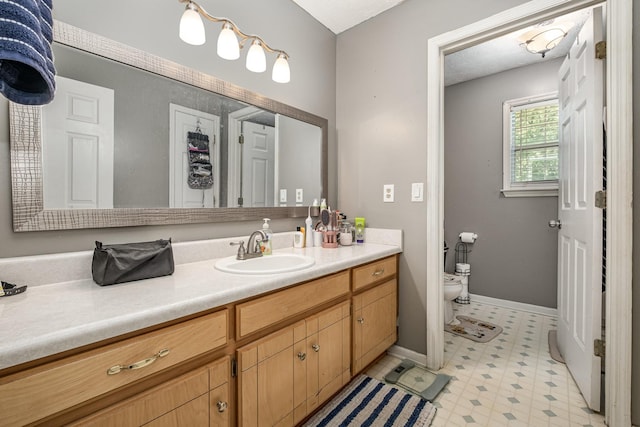 124 Gale Ln, La Vergne, TN 37086 - bathroom featuring vanity, tile patterned floors, toilet, and baseboards