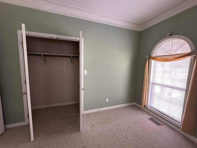 95 Dundee Cir, Mcminnville, TN 37110 - unfurnished bedroom featuring crown molding, carpet, a closet, and baseboards