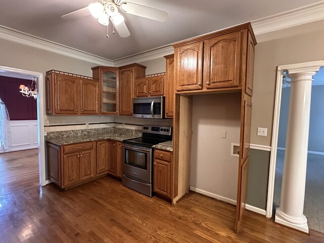 95 Dundee Cir, Mcminnville, TN 37110 - kitchen featuring stainless steel appliances, ceiling fan, brown cabinets, ornamental molding, and glass insert cabinets