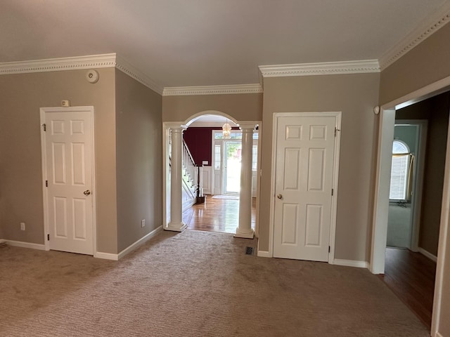 95 Dundee Cir, Mcminnville, TN 37110 - hallway with ornate columns, arched walkways, carpet flooring, and crown molding