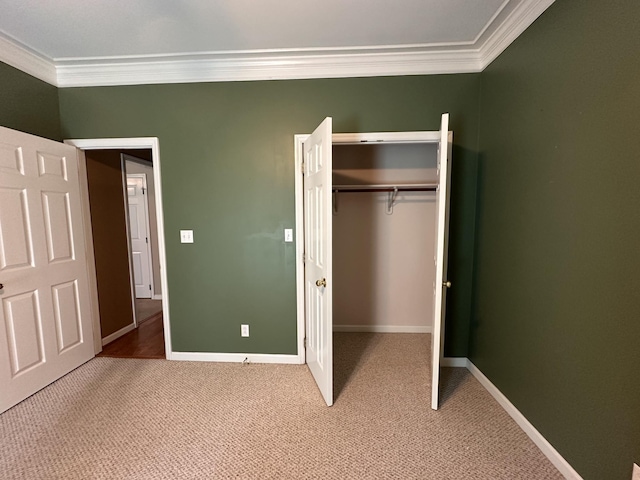 95 Dundee Cir, Mcminnville, TN 37110 - unfurnished bedroom featuring ornamental molding, light colored carpet, a closet, and baseboards