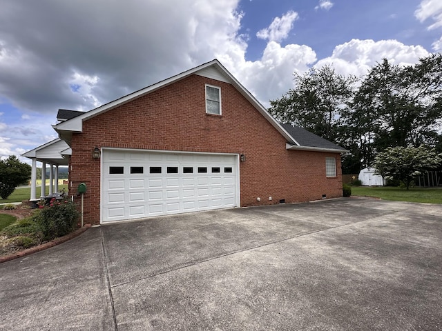 95 Dundee Cir, Mcminnville, TN 37110 - view of property exterior featuring brick siding, concrete driveway, crawl space, and a garage