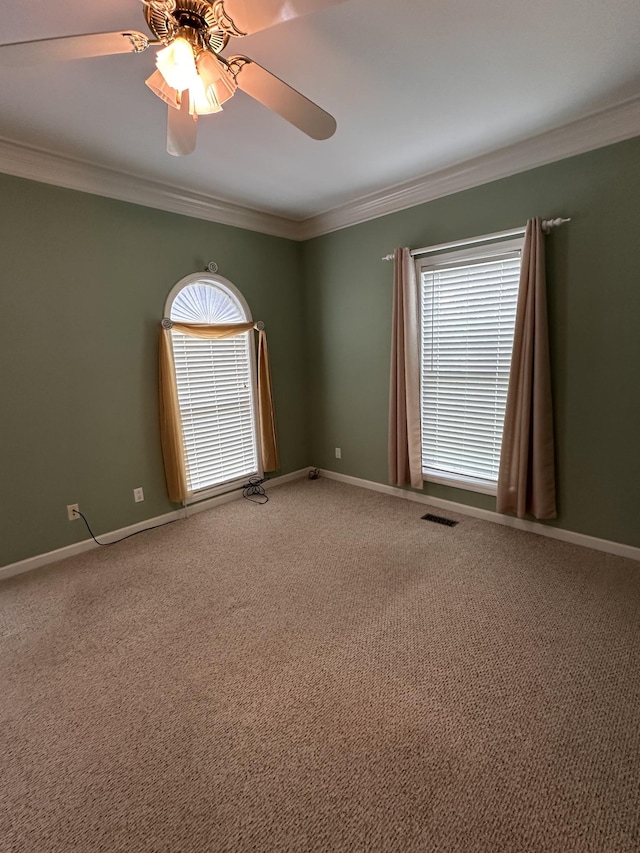 95 Dundee Cir, Mcminnville, TN 37110 - empty room featuring healthy amount of natural light, crown molding, a ceiling fan, light colored carpet, and baseboards
