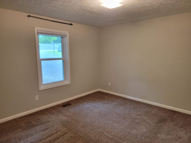 129 Peggy Ct, Goodlettsville, TN 37072 - unfurnished room featuring a textured ceiling, dark carpet, and baseboards