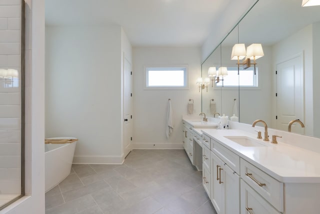 4761 Woodrow Pl, Arrington, TN 37014 - full bath featuring double vanity, a freestanding bath, a chandelier, and baseboards