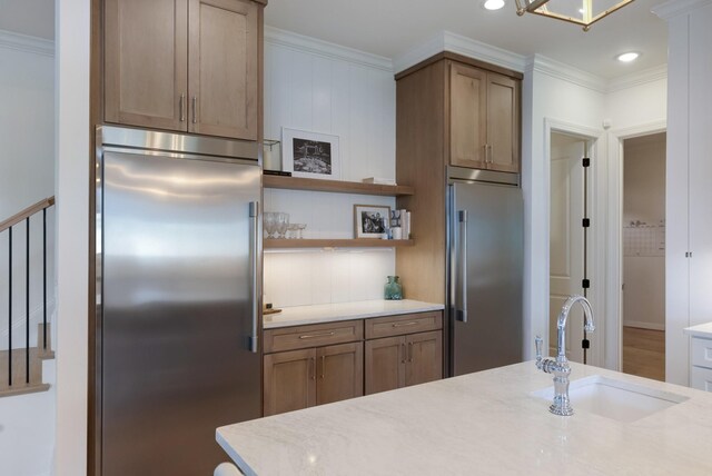 4761 Woodrow Pl, Arrington, TN 37014 - kitchen featuring built in refrigerator, high quality fridge, a sink, ornamental molding, and open shelves