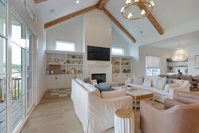 4761 Woodrow Pl, Arrington, TN 37014 - living room featuring high vaulted ceiling, a chandelier, beam ceiling, a fireplace, and light wood finished floors