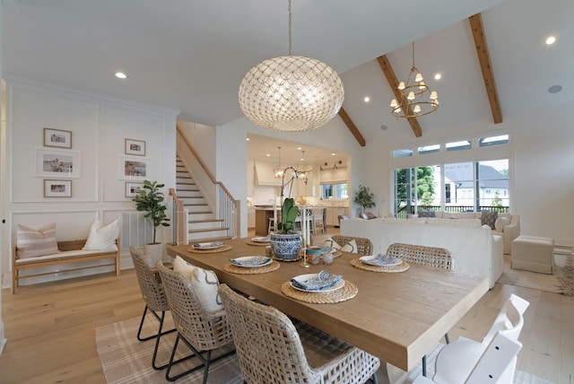 4761 Woodrow Pl, Arrington, TN 37014 - dining space with a chandelier, high vaulted ceiling, beam ceiling, stairway, and light wood-style flooring