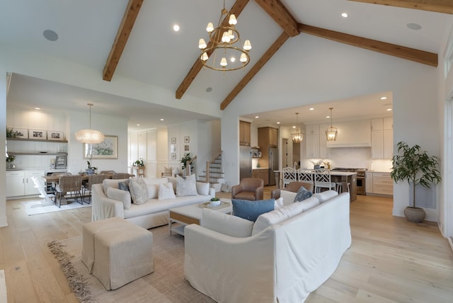 4761 Woodrow Pl, Arrington, TN 37014 - living area featuring high vaulted ceiling, light wood finished floors, a chandelier, beam ceiling, and stairway
