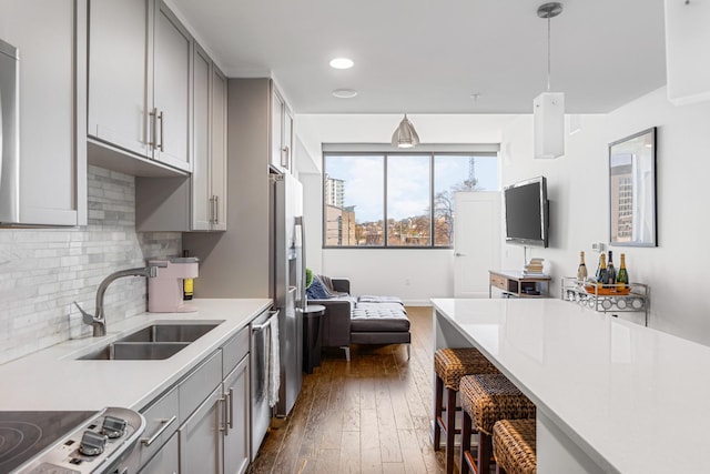 1212 Laurel St Unit 206, Nashville, TN 37203 - kitchen with gray cabinetry, a sink, light countertops, dark wood-style floors, and recessed lighting