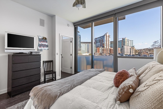1212 Laurel St Unit 206, Nashville, TN 37203 - bedroom featuring a city view, wood finished floors, and baseboards