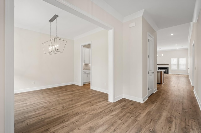 7503 Old Nashville Rd, Fairview, TN 37062 - hallway featuring a chandelier, ornamental molding, wood finished floors, and recessed lighting