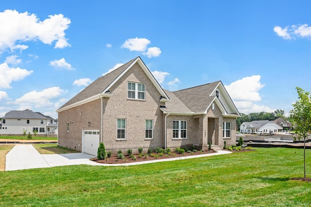 7503 Old Nashville Rd, Fairview, TN 37062 - view of side of property with brick siding, concrete driveway, a yard, and a garage