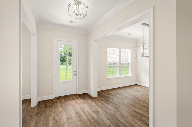 7503 Old Nashville Rd, Fairview, TN 37062 - entryway featuring a chandelier, wood finished floors, healthy amount of natural light, and crown molding
