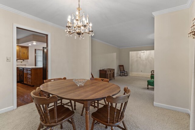 7125 Bidwell Rd, Joelton, TN 37080 - carpeted dining space with baseboards, crown molding, and a chandelier