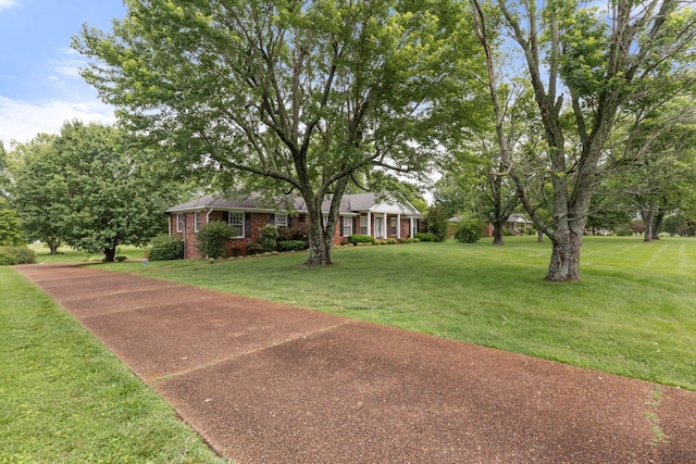 7125 Bidwell Rd, Joelton, TN 37080 - view of front facade featuring brick siding and a front yard