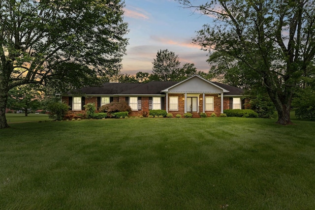 7125 Bidwell Rd, Joelton, TN 37080 - ranch-style home with a lawn and brick siding