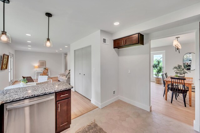 1192 Dalemere Dr, Nashville, TN 37207 - kitchen with stainless steel dishwasher, light stone counters, pendant lighting, dark brown cabinets, and recessed lighting