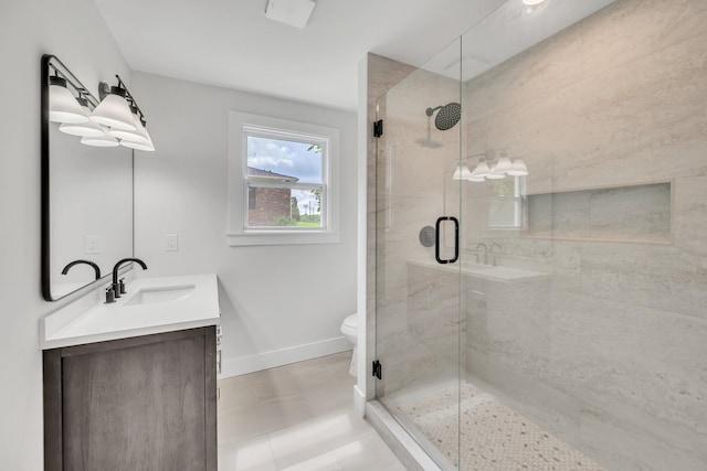 1192 Dalemere Dr, Nashville, TN 37207 - bathroom featuring vanity, a stall shower, baseboards, toilet, and tile patterned floors