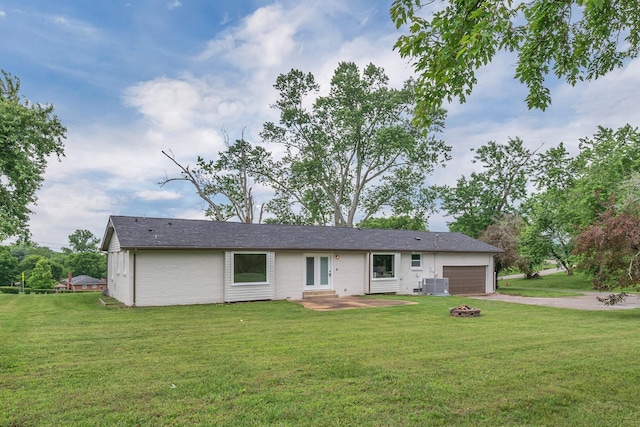 1192 Dalemere Dr, Nashville, TN 37207 - ranch-style house with central AC unit, an attached garage, driveway, and a front lawn