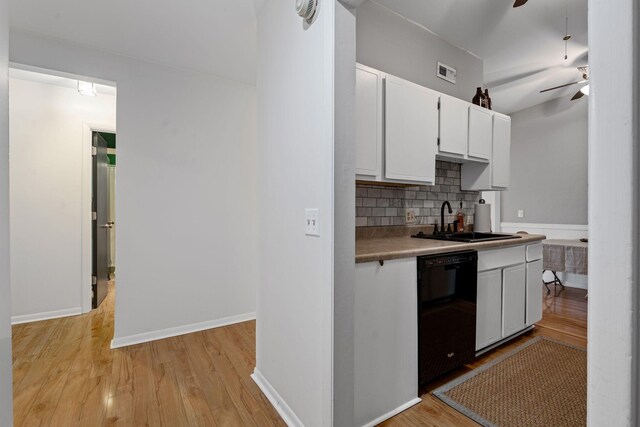 4425 Westlawn Dr Unit A301, Nashville, TN 37209 - kitchen with black dishwasher, a sink, a ceiling fan, backsplash, and white cabinets
