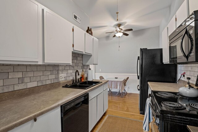 4425 Westlawn Dr Unit A301, Nashville, TN 37209 - kitchen featuring black appliances, a sink, a ceiling fan, decorative backsplash, and white cabinets