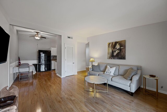4425 Westlawn Dr Unit A301, Nashville, TN 37209 - living area with a ceiling fan, light wood-style floors, and baseboards
