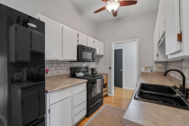 4425 Westlawn Dr Unit A301, Nashville, TN 37209 - kitchen with black appliances, a sink, a ceiling fan, and tasteful backsplash