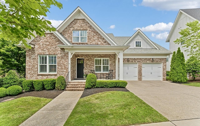 6086 Maysbrook Ln, Franklin, TN 37064 - view of front of home featuring concrete driveway, brick siding, a front lawn, and a porch