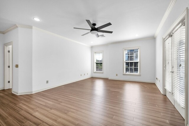 1010 16th Ave S Unit 301, Nashville, TN 37212 - unfurnished living room featuring crown molding, a ceiling fan, wood finished floors, baseboards, and recessed lighting