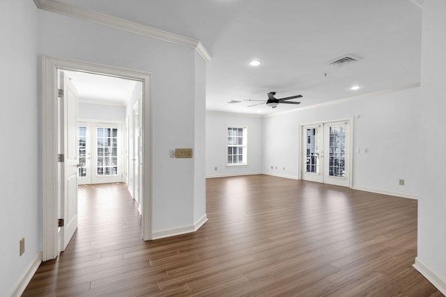 1010 16th Ave S Unit 301, Nashville, TN 37212 - unfurnished living room featuring crown molding, french doors, ceiling fan, dark wood-type flooring, and baseboards
