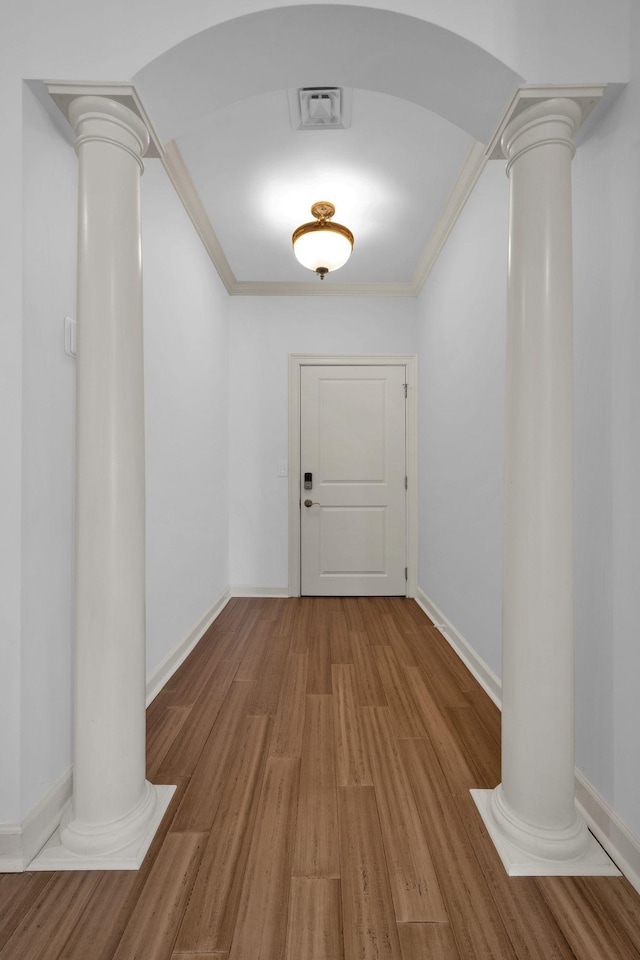 1010 16th Ave S Unit 301, Nashville, TN 37212 - hall with ornate columns, wood finished floors, ornamental molding, baseboards, and arched walkways