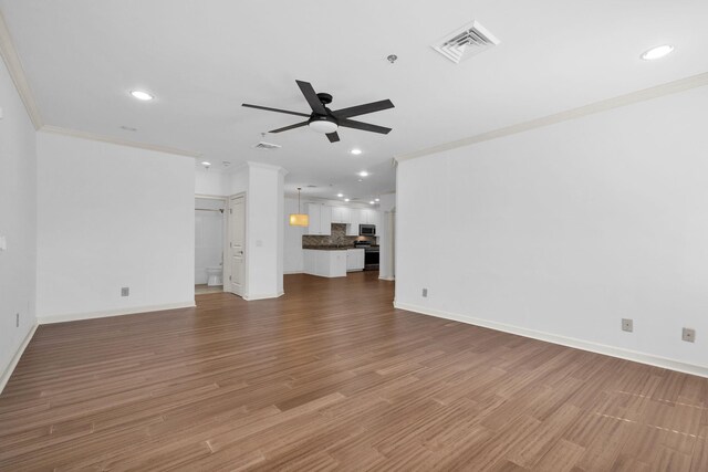 1010 16th Ave S Unit 301, Nashville, TN 37212 - unfurnished living room with a ceiling fan, recessed lighting, ornamental molding, baseboards, and wood finished floors