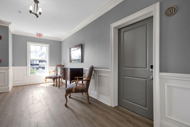 1010 16th Ave S Unit 301, Nashville, TN 37212 - living area featuring ornamental molding, a wainscoted wall, a decorative wall, and wood finished floors