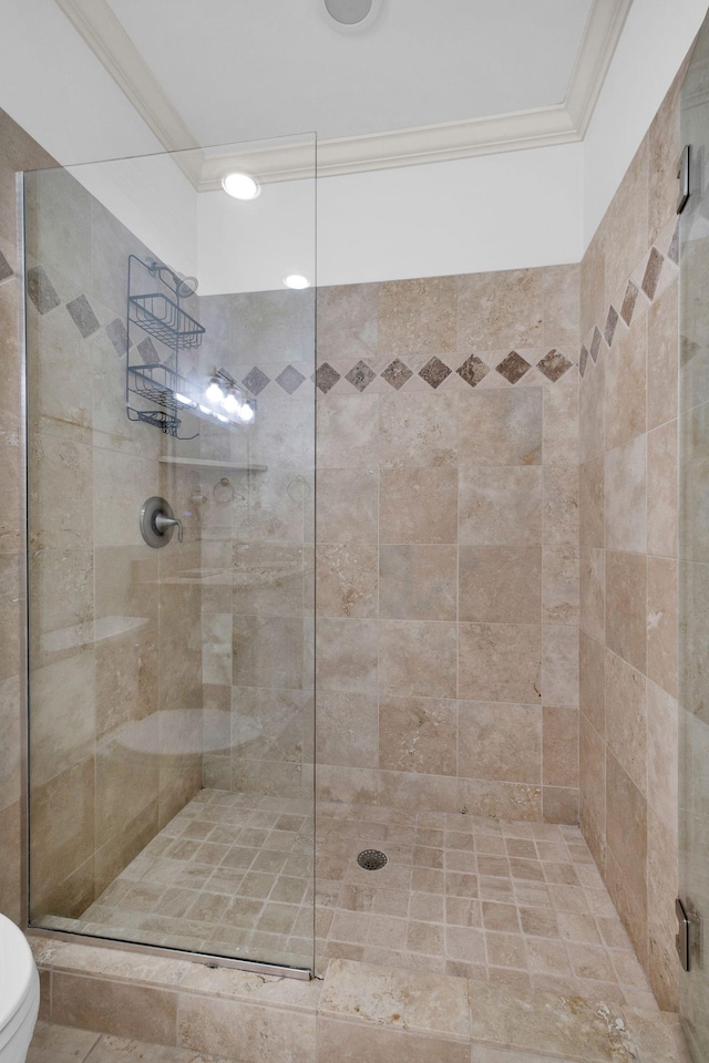 1010 16th Ave S Unit 301, Nashville, TN 37212 - full bath with a tile shower, toilet, and crown molding