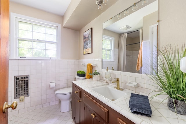 4600 Saunders Ave, Nashville, TN 37216 - bathroom with heating unit, vanity, toilet, tile patterned flooring, and tile walls