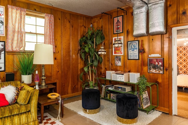 4600 Saunders Ave, Nashville, TN 37216 - sitting room featuring wood walls, ornamental molding, and a textured ceiling