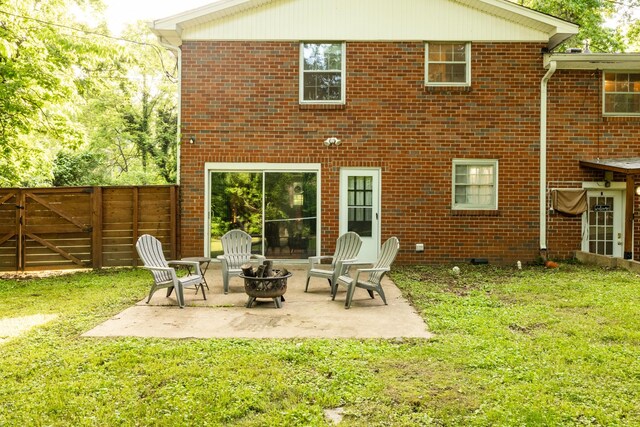 4600 Saunders Ave, Nashville, TN 37216 - back of property with an outdoor fire pit, a patio, brick siding, and a gate