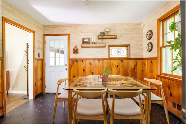 4600 Saunders Ave, Nashville, TN 37216 - dining room featuring plenty of natural light, wainscoting, dark tile patterned floors, and wooden walls